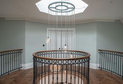 Bespoke stairwell cluster chandelier designed by Fritz Fryer